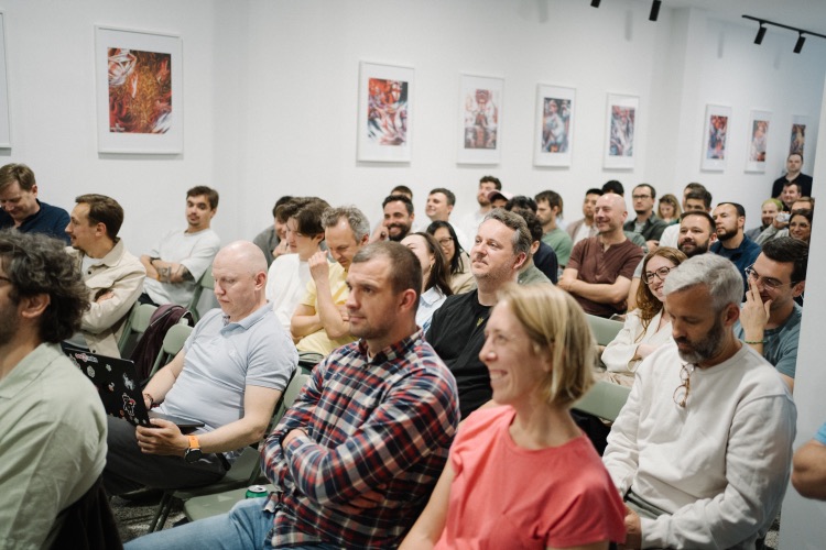 Audience listening during a previous n8n community event