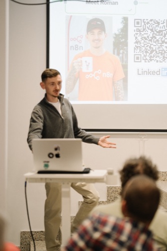 An n8n community speaker presenting to an audience