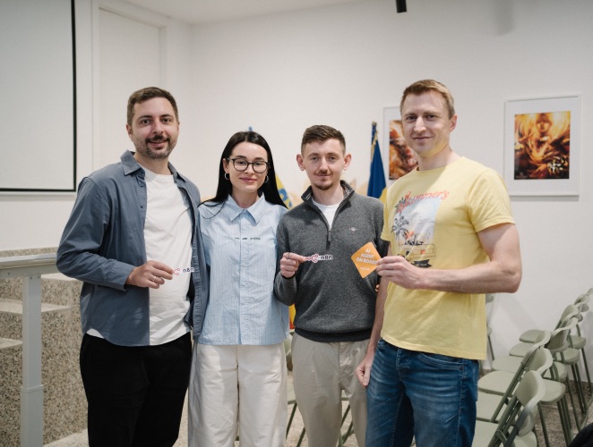 Four n8n community organizers posing together after an event